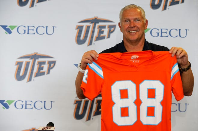 UTEP head coach Dana Dimel holds one up of the jerseys that will be given away to the first 1,000 fans that attend this Saturday’s homecoming game in the Sun Bowl when the Miner take on the MeanGreen of the University of North Texas. The jersey is a replica of the one worn by the 1988 team, who went on to play in the Independence Bowl in Shreveport, La. in former head coach and Athletic Director Bob Stulls final game as head coach before moving to Missouri as their head coach.