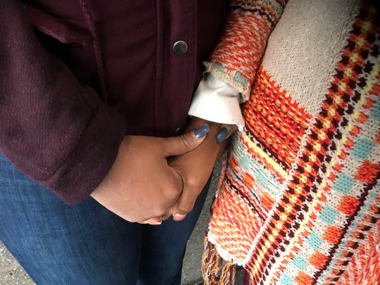 A Detroit woman seeks comfort after she and a friend got raped by a gunman while vacationing in Jamaica on Sept. 27, 2018. 
The victim, who is on the right, got the gun and shot the attacker, who is in police custody. The other victim is not pictured. 
