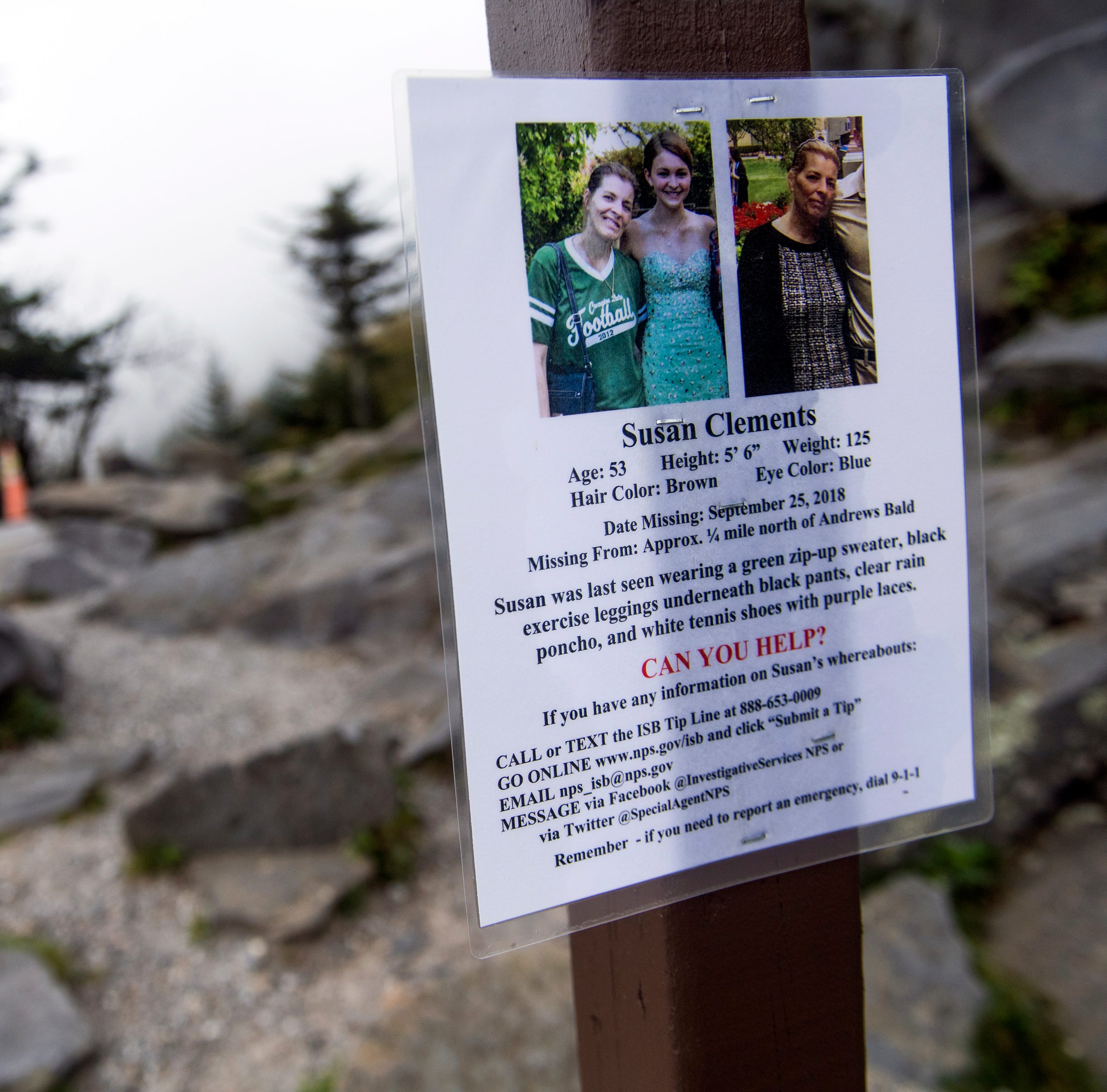 Signs describing missing Ohio woman Mitzie Sue Clements hang at the Clingmans Dome parking lot in the Great Smoky Mountains National Park on Tuesday, October 2, 2018.