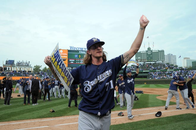 A triumphant Josh Hader walks off the field after the Brewers beat the Cubs on Oct. 1 in Chicago to claim the NL Central Division title.