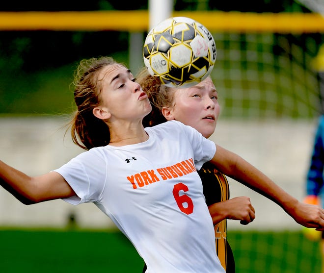 York Suburban's Hannah Drahusz and Red Lion's Shaye Robertson vie for possession during soccer action at Red Lion Tuesday, Oct. 2, 2018. Red Lion won 5-0. Bill Kalina photo
