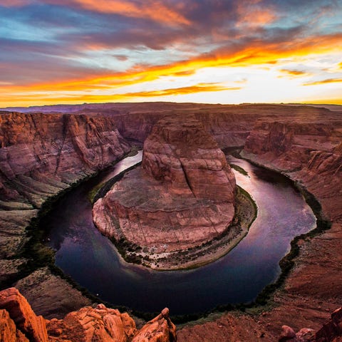 The sun sets over the Colorado River at Horseshoe...