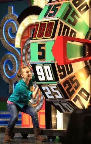 A contestant competes on "The Price is Right Live."