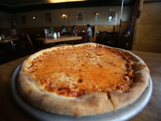 A cheese pizza at La Manda's restaurant. Old-school Greenburgh staple has been serving thin-crust pies since 1947. Photographed May 26, 2017.