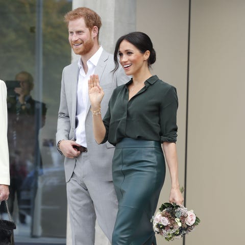 Meghan wore a forest-green leather skirt from...