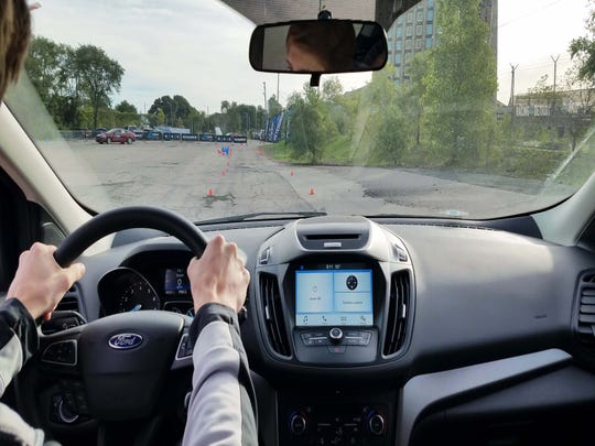 Floor it! Students must get a car up to 40 mph before slamming on the brakes and taking cone-avoidance action to simulate real-world panic conditions.