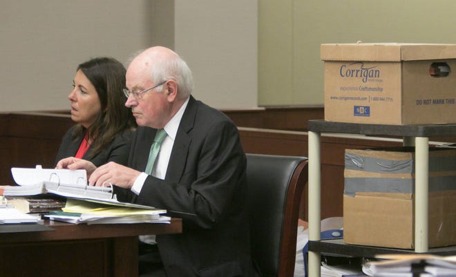 Judge Theresa Brennan and her attorney Dennis Kolenda listen to testimony at the Judicial Tenure Commission hearing Thursday, Oct. 4, 2018, seated next to boxes of documents.