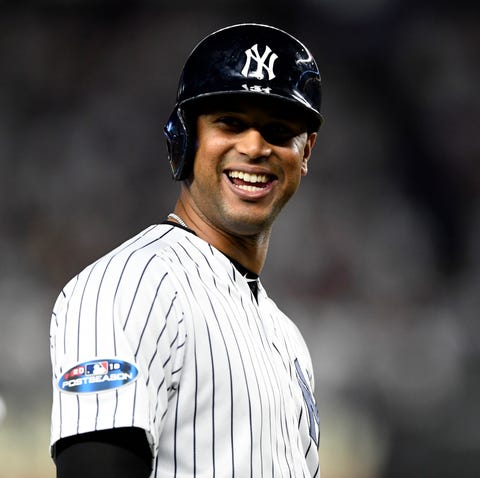 New York Yankees' Aaron Hicks smiles at third...