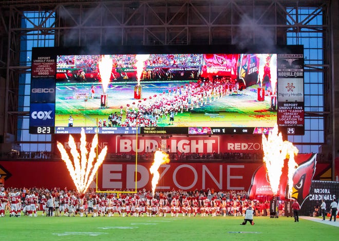 Arizona Cardinals players enter the field prior to the game against the Denver Broncos during a pre season game at University of Phoenix Stadium. Mandatory Credit: Mark J. Rebilas-USA TODAY Sports