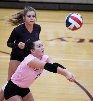 Henderson's Maggie Vincent (11) returns a serve as the Henderson County Lady Colonels play the Caldwell County Lady Tigers at Colonel Gym Thursday, October  4, 2018.