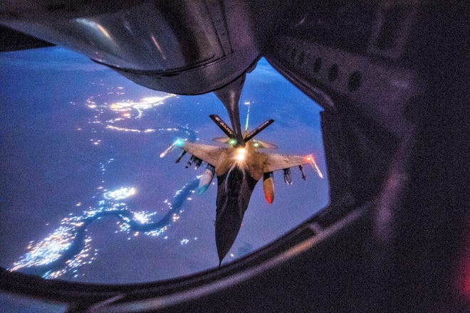 An Air Force F-16 Fighting Falcon, assigned to the 157th Expeditionary Fighter Squadron, receives in-flight fuel from a KC-135 Stratotanker during a mission in support of Operation Inherent Resolve over Iraq, Sept. 21, 2018. U.S. and Coalition aircraft provide unmatched combat capability in support of U.S. Central Command military objectives.