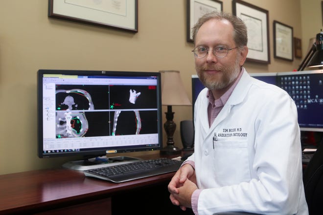 Capital Regional Cancer Center Radiation Oncologist Tim Bolek demonstrates the dosimetry software used in creating treatment plans for cancer patients Friday, Oct. 5, 2018 in Tallahassee, Fla. The program allows the staff to carefully calculate the dose and location of radiation that goes into the body during treatment. 