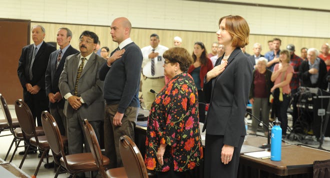 From left, Richard Araiza, Andy Sobel, Carlos Juarez, Aaron Dunkel, Ginger Gherardi and Jenny Crosswhite stand for the Pledge of Allegiance at the beginning of a Santa Paula City Council candidates forum.