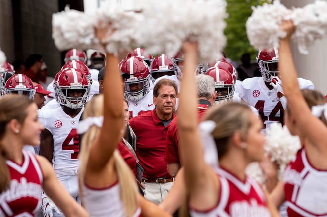 Alabama head coach Nick Saban leads Alabama onto the field before the Arkansas game in Fayetteville, Ark., on Saturday October 6, 2018.