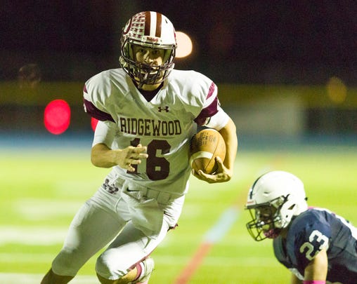 Ridgewood quarterback William Mollihan heads for the end zone in overtime against Paramus in Friday night's high school football showdown in Paramus. Paramus won the overtime thriller, 35-34, on Oct. 5, 2018