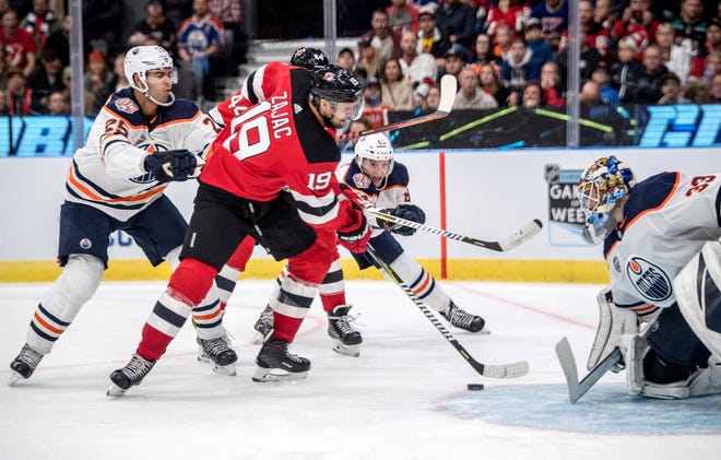 New Jersey Devils' Travis Zajac scores during the season-opening NHL Global Series hockey match between Edmonton Oilers and New Jersey Devils at Scandinavium in Gothenburg, Sweden, Saturday, Oct. 6, 2018,