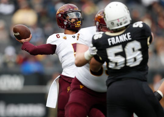 Arizona State quarterback Manny Wilkins, back, throws a pass against against Colorado in the first half of an NCAA college football game Saturday, Oct. 6, 2018, in Boulder, Colo. (AP Photo/David Zalubowski)