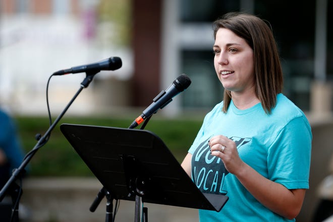 Rep. Crystal Quade, D-Springfield, speaks to a crowd of a few hundred people at the Me Too Springfield rally in downtown Springfield on Saturday, Oct. 6, 2018.