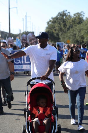 Andrew Gillum waves during the Florida A&M homecoming parade Saturday, Oct. 6, 2018.