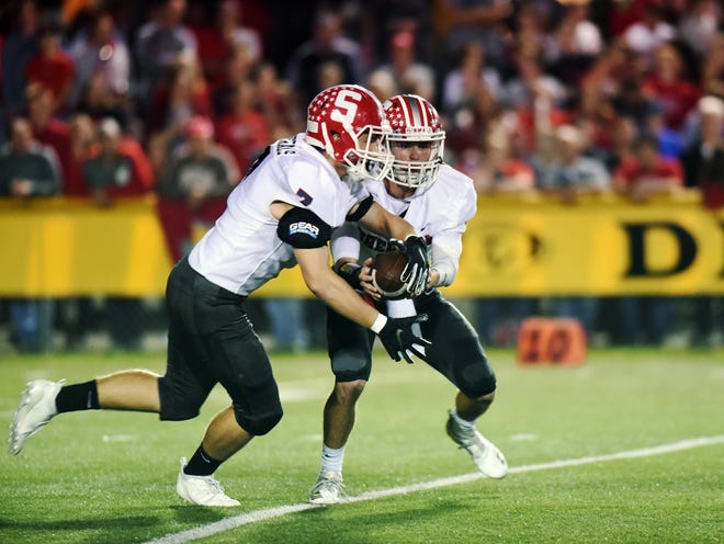 Sheridan's Will Hamilton, left, and Ethan Heller run the read option against Tri-Valley. Heller was named Southeast District Offensive Player of the Year by the Ohio Prep Sportswriters Association.