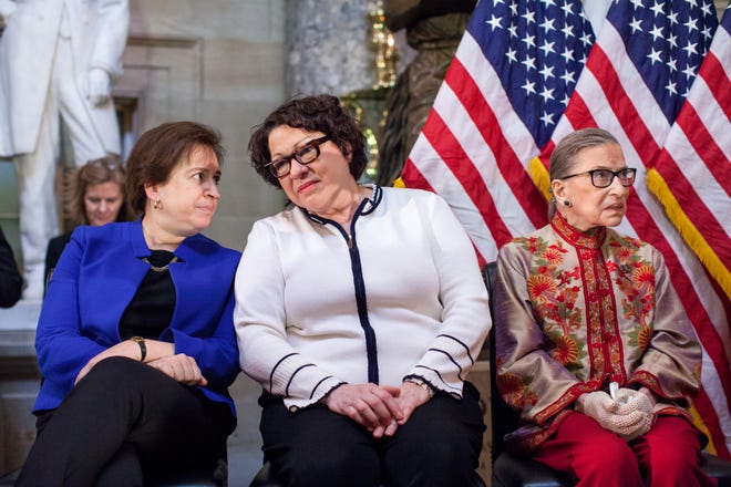 U.S. Supreme Court justices Elena Kagan, Sonia Sotomayor and Ruth Bader Ginsburg, participate in an annual Women's History Month reception hosted by Democratic House Leader Nancy Pelosi in the U.S. capitol building on Capitol Hill in Washington, D.C.