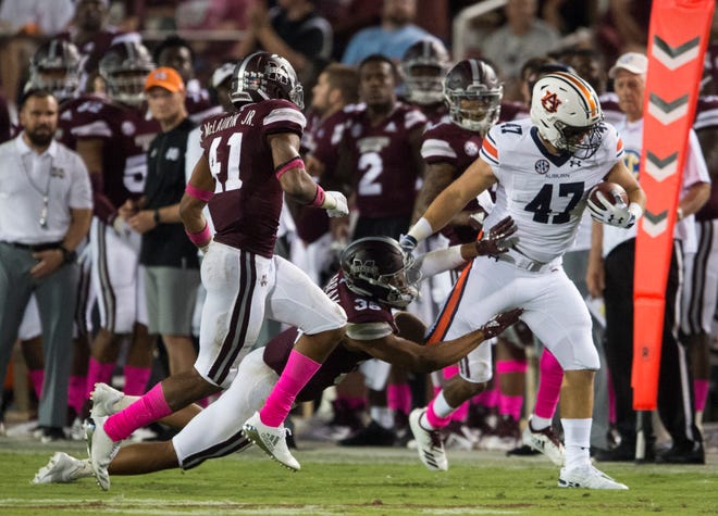 Auburn’s John Samuel Shenker (47) is pushed out of bounds by Mississippi State’s Johnathan Abram (38) at Davis Wade Stadium in Starkville, Miss., on Saturday, Oct. 6, 2018. Mississippi State defeated Auburn 23-9.