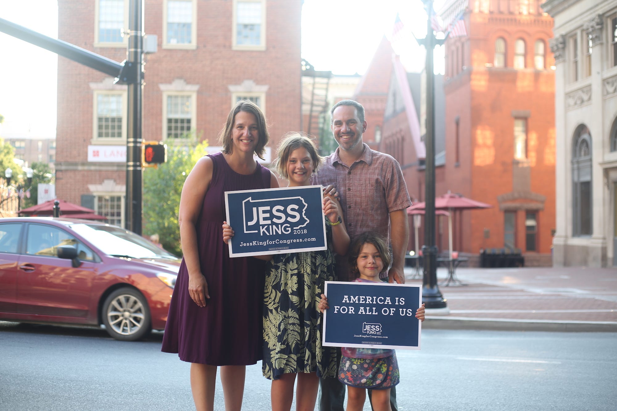 Nonprofit executive Jess King poses with her family in Lancaster. King, a Democrat, is working to unseat Republican incumbent Lloyd Smucker in the newly redrawn 11th congressional district.