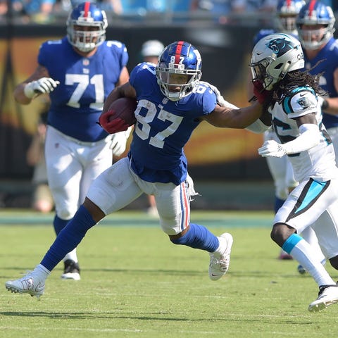 New York Giants' Sterling Shepard runs after a...