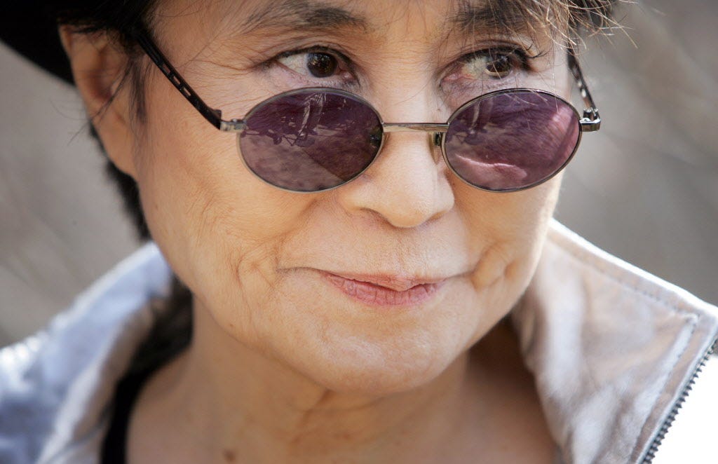 Japanese artist Yoko Ono, widow of Beatles member John Lennon, arrives to dedicate "Wish Tree for Washington, DC" at the Hirshorn Museum's Sculpture Garden as part of "Yoko Ono: Imagine Peace" 02 April 2007 in Washington. The Wish Tree series, which Ono began in the 1990s, encourages the public to become participants in the art-making process by inviting visitors to write wishes on paper and tie them to the tree.        AFP PHOTO/Tim SLOAN   (Photo credit should read TIM SLOAN/AFP/Getty Images) ORG XMIT: TGS005