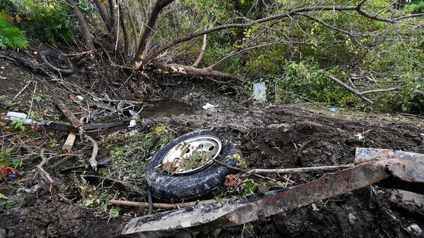 Debris scatters an area Sunday, Oct. 7, 2018, at...