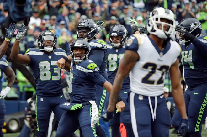 Seahawks quarterback Russell Wilson threw three touchdown passes in Sunday's loss to the Los Angeles Rams.