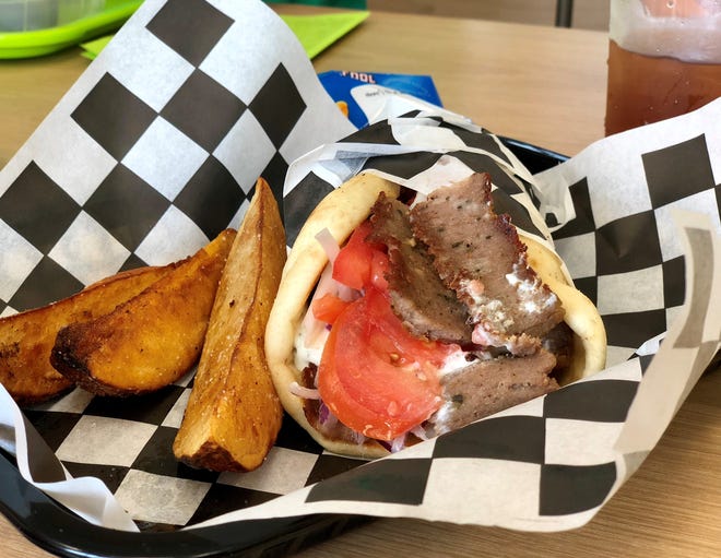 A lamb gyro with potato wedges from Hot Gyros & More near Gateway.