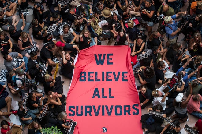WASHINGTON, DC - OCTOBER 4: Protestors rally against Supreme Court nominee Judge Brett Kavanaugh in the atrium of the Hart Senate Office Building on Capitol Hill, October 4, 2018 in Washington, DC. Kavanaugh's confirmation process was halted for less than a week so that FBI investigators could look into allegations by Dr. Christine Blasey Ford, a California professor who has accused Kavanaugh of sexually assaulting her during a party in 1982 when they were high school students in suburban Maryland. (Photo by Drew Angerer/Getty Images)