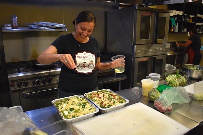 Chef Michele Cave works in the kitchen at her Red Bicycle Catering in downtown Redding.