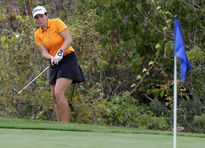 Lily Sheppard of Kaukauna chips onto the green during Friday's first round of the state tournament at University Ridge.