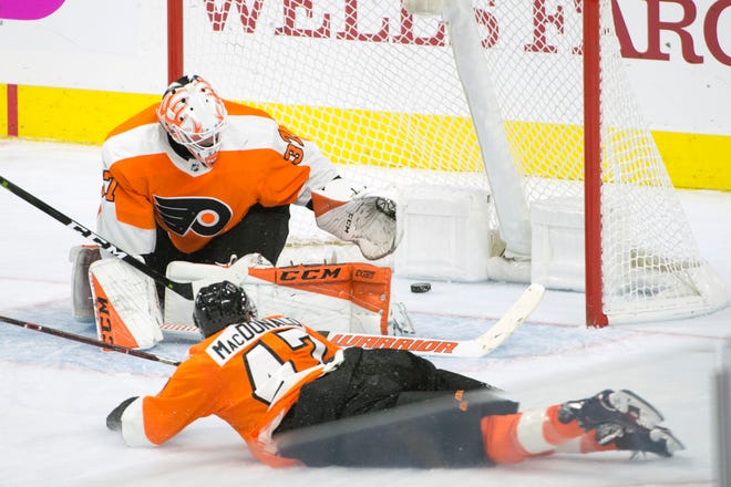 Another puck gets by Flyers goalie Brian Elliot (37) against the Sharks Tuesday, Oct. 9, 2018 at the Wells Fargo Center in Philadelphia, Pa. The Flyers lost 8-2.