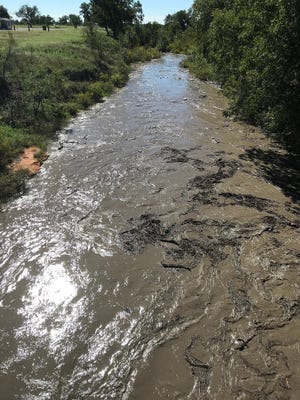 The North Concho River after flood waters flow in from Carlsbad to Grape Creek Wednesday, Oct.10, 2018.