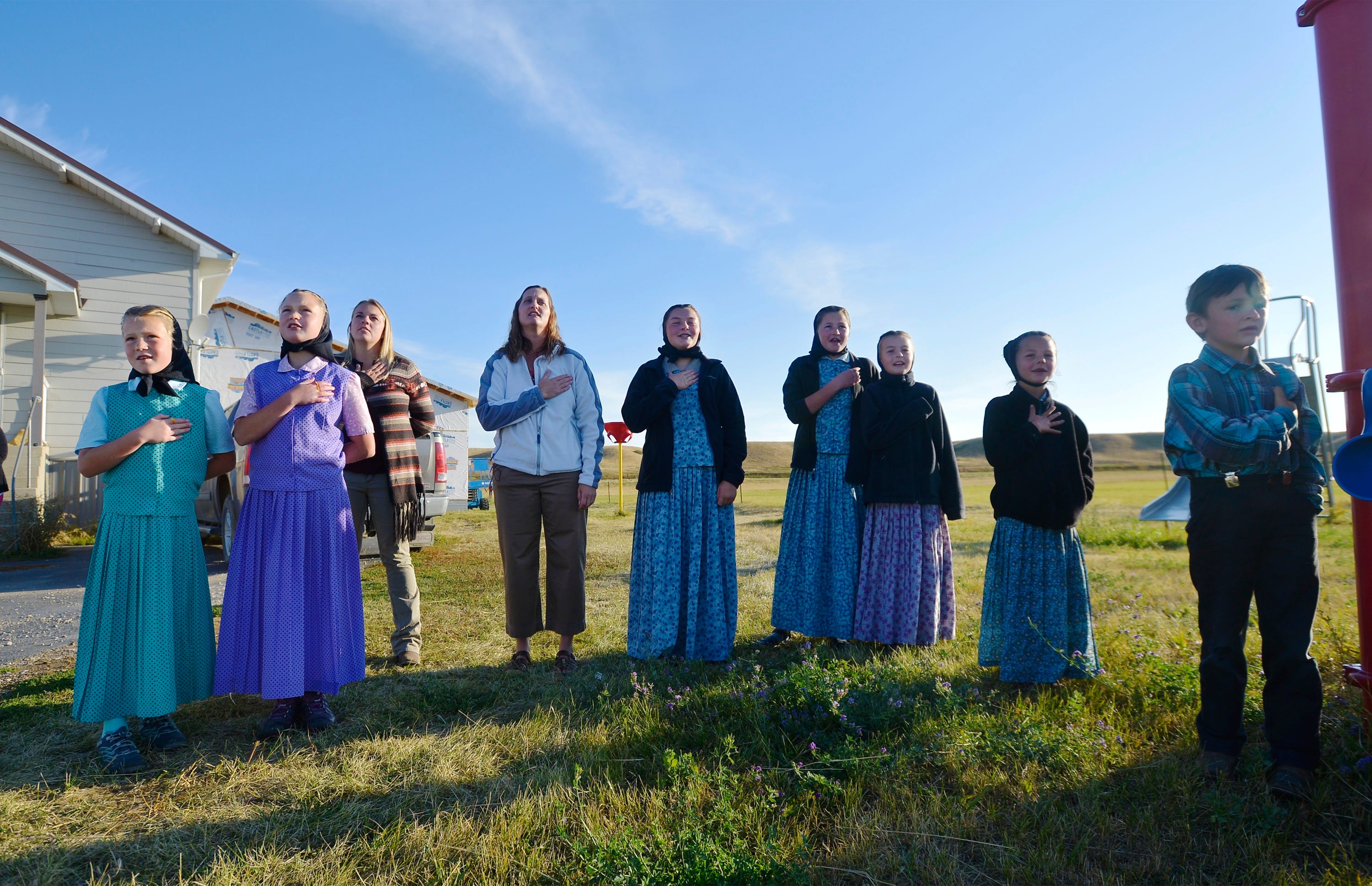 Traci Manseau, fourth from left, recites the Pledge of Allegiance with her students. Manseau is a teaching veteran of 23 years, and she has spent her entire career teaching in one-room rural schoolhouses.