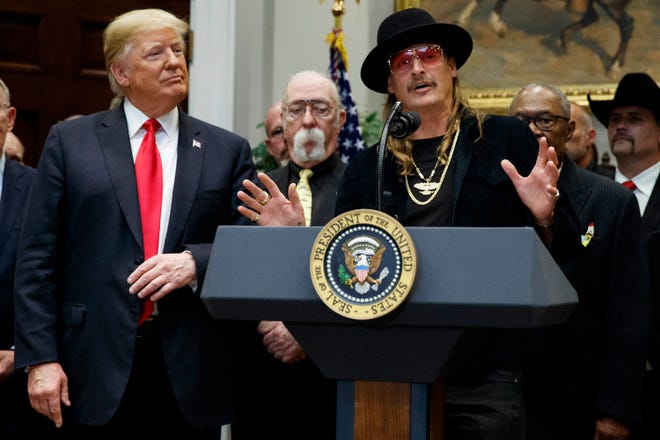President Donald Trump looks on as musician Kid Rock speaks during a signing ceremony for the "Orrin G. Hatch-Bob Goodlatte Music Modernization Act," in the Oval Office of the White House, Thursday, Oct. 11, 2018, in Washington.