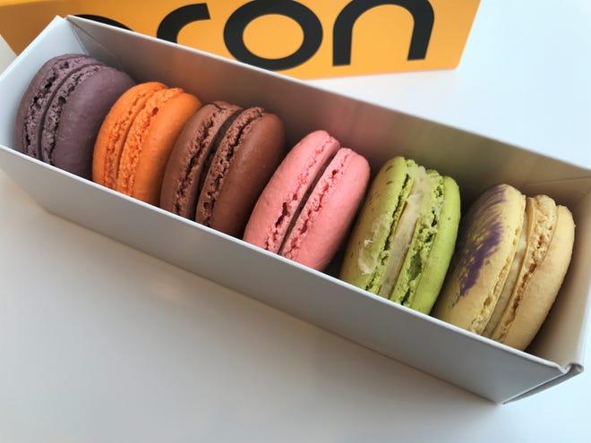 Lemon lavender, pistachio, strawberry chocolate, dark chocolate, pumpkin spice and black raspberry chocolate macarons in a to-go box at Macaron Bar, 425 Mass Ave., Indianapolis.