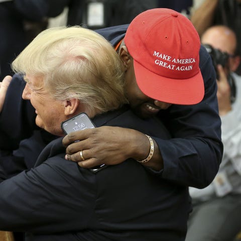 Kanye West hugs President Donald Trump after...