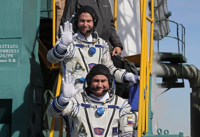 Members of the International Space Station (ISS) expedition 57/58, NASA astronaut Nick Hague and Roscosmos cosmonaut Alexey Ovchinin board the Soyuz MS-10 spacecraft prior to the launch at the Russian-leased Baikonur cosmodrome in Kazakhstan on October 11, 2018.
