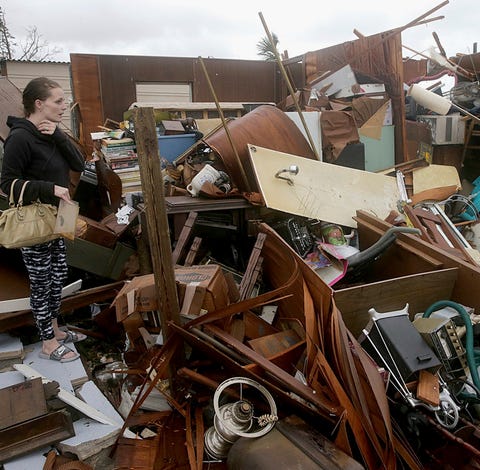 Haley Nelson inspects damages to her family...