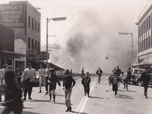 Youth who had been watching Elvis Presley's "Stay Away, Joe" at the State Theatre flee the scene if a natural gas fire in downtown Richmond, Ind., on April 6, 1968, which killed 41 people.