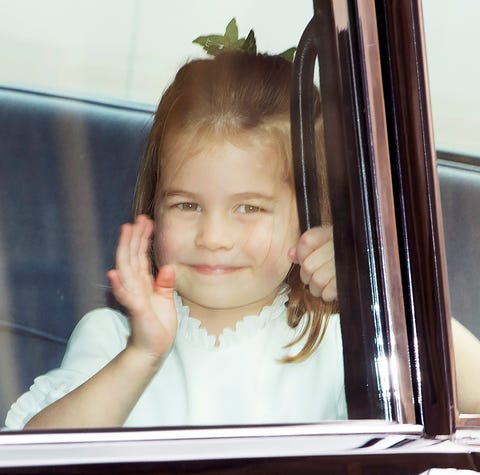 epa07087803 Princess Charlotte waves to people as...