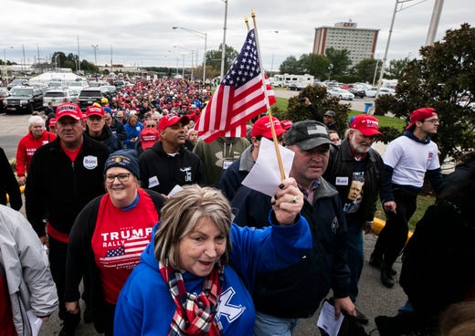 Thousands of Donald Trump supporters walk towards the Alumni Coliseum for the speech of President Donald Trump Saturday night.