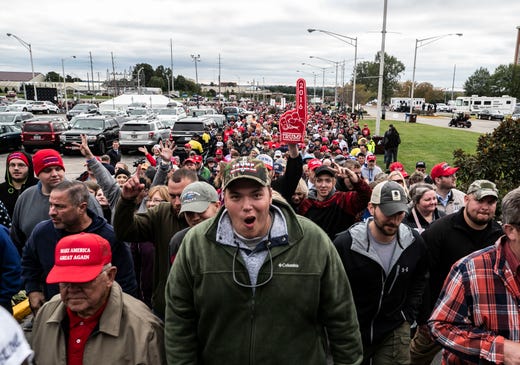 Thousands of Donald Trump supporters walk towards the Alumni Coliseum for the speech of President Donald Trump Saturday night.