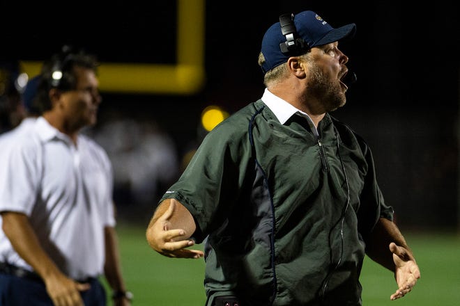 Naples High School defensive coordinator Sam Dollar, shown during an Oct. 12, 2018, game against Golden Gate, had his fifth son with his wife, Stephanie, on Monday. Dollar had to miss time with the team the week before Friday's win over Fort Myers because his wife was in the hospital.