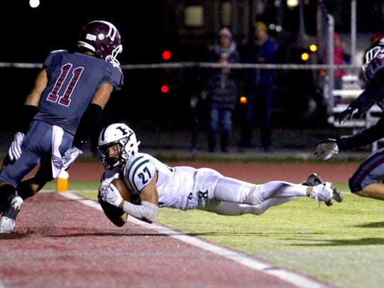 Ramapo's Max Baker dives into the end zone against Wayne Hills on Friday, Oct. 12.