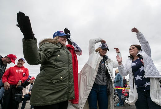 The crowd waiting for President Donald Trump danced as 1970s group The Village People's 'YMCA' played on loudspeakers in a parking lot outside the Alumni Coliseum in Richmond, Ky.